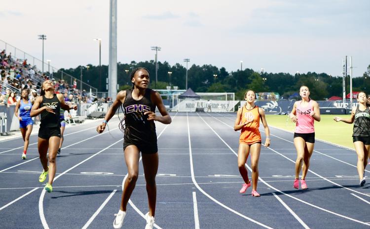 Columbia’s J’Liyn Smith leads the pack during the 400m at the Region 1-3A meet on Wednesday. Smith won the race in 58.06 seconds. (NANCY SCOTT/Special to the Reporter)