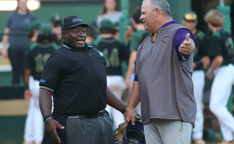Columbia coach Chris Howard argues a call with the home plate umpire during Thursday's District 2-5A championship against Lincoln. (JORDAN KROEGER/Lake City Reporter)