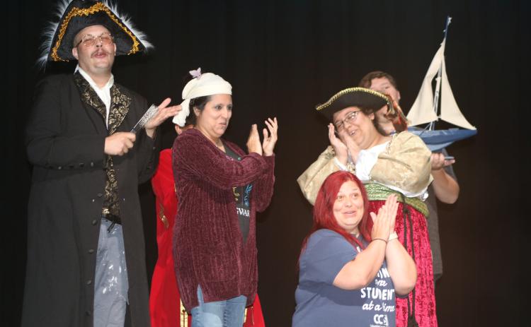 Josh Garner (from left), Jenny Martinez, Mychelle Albury and Sierra McClain sing during a musical number while rehearing for the upcoming production of Peter and the Star Catcher at Florida Gateway College. (TONY BRITT/Lake City Reporter)