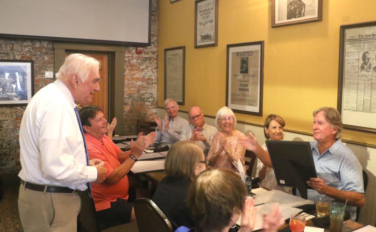 Mayor Stephen Witt delivers a speech during Keith Williams’ retirement party Thursday at Marion Street Bistro. Witt also provided Williams with a proclamation celebrating his years of service. (MORGAN MCMULLEN/Lake City Reporter)