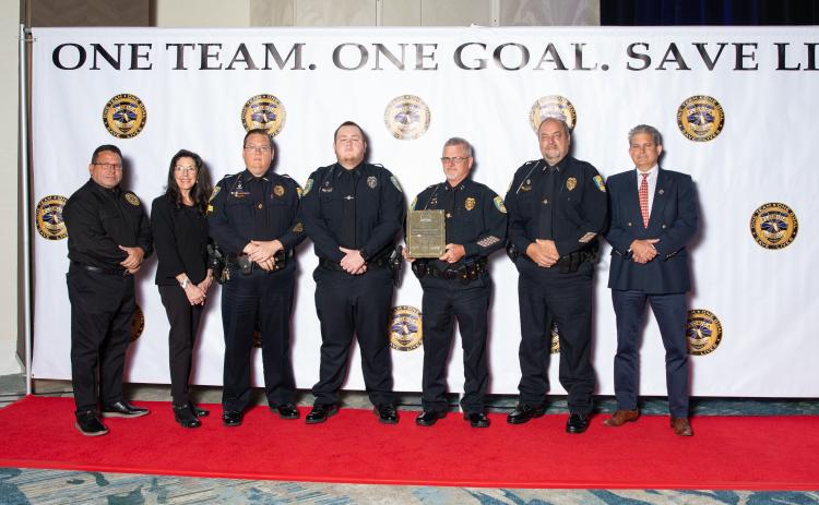 The Lake City Police Department received the top traffic safety award at last week’s Traffic Safety Challenge Awards ceremony. Accepting the award for the LCPD were Sgt. Mike Lee (third from left), Traffic Officer Blake Craig, Assistant Chief Andy Miles and Lt. Robert Milligan. (COURTESY LAKE CITY POLICE DEPARTMENT)