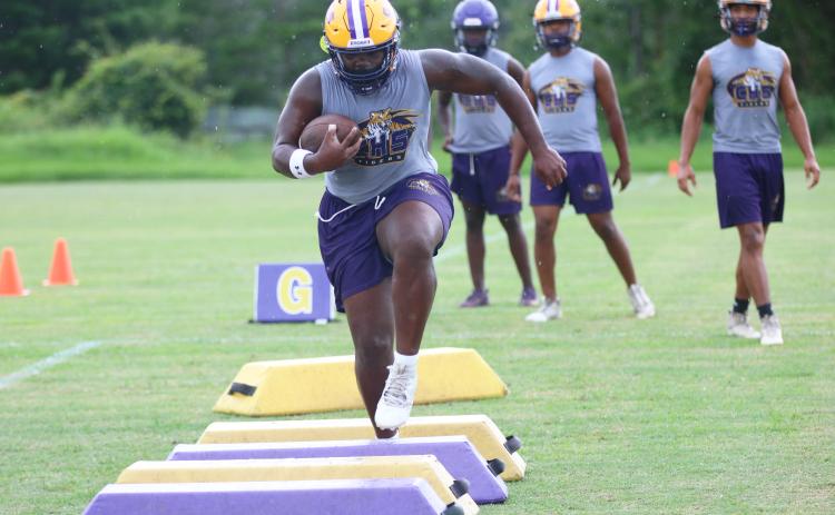 Columbia running back Johnathan Andrews runs through a drill during Monday's practice. (JORDAN KROEGER/Lake City Reporter)