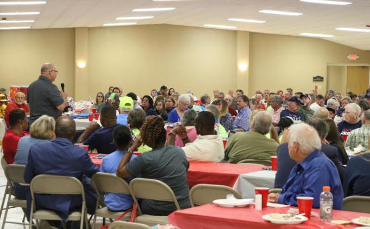 Columbia County Commissioner Rocky Ford (standing, left) speaks at the 2022 GOP candidate rally at the Columbia County Fairgrounds. (FILE)