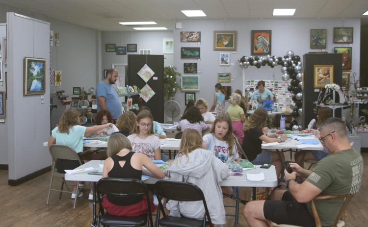 Area youngsters and some of their parents take part in the Young daVinci Summer Art Camp at the Gateway Art Gallery. This year’s camp was funded through a grant from Clay Electric and had 20 children attend the three-day camp. (TONY BRITT/Lake City Reporter)