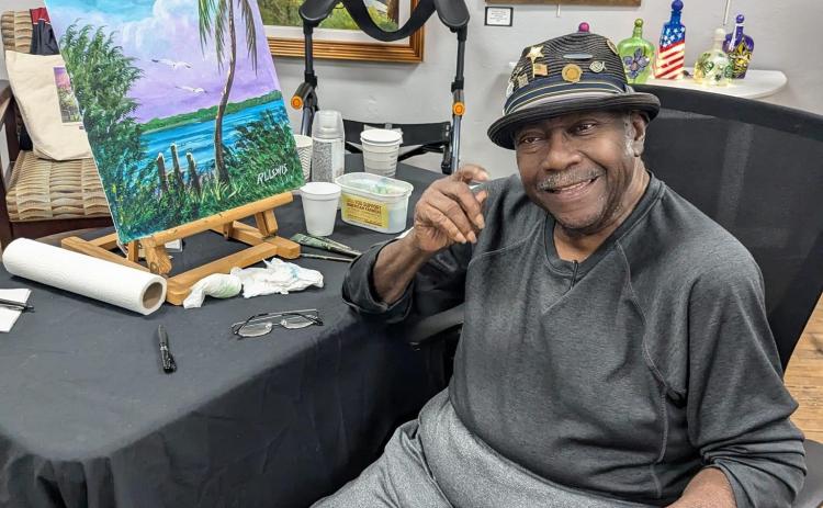 R.L. Lewis, an original Florida Highwaymen artist, demonstrated his artistic style at the Gateway Art Gallery on Saturday. (COURTESY)