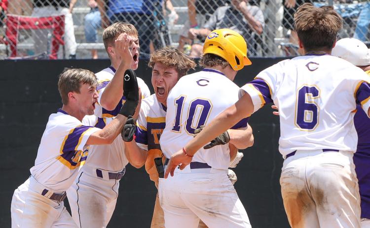 Columbia’s Ayden Phillips hugs Josh Fernald (10) at home plate after Fernald hit a walk-off grand slam against Lincoln in the Region 1-5A semifinals on May 12, 2023. (FILE)