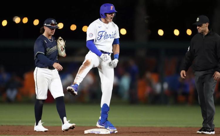 Florida’s Tyler Shelnut, a former Fort White High star, gestures after a hit this spring with the Gators. Shelnut is awaiting a phone call this weekend of early next week letting him know he’s been taken in the MLB draft. (MADDIE WASHBURN/UF Athletics)