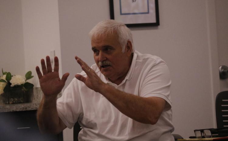 Dale Williams, who is likely to serve as a consultant performing administrative duties for the North Florida Water Utilities Authority, talks to the authority board Monday about the process of hiring an executive director. (JAMIE WACHTER/Lake City Reporter)