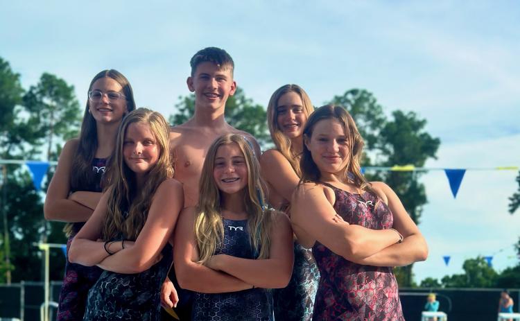 The Columbia Swim Team qualified six swimmers for next week’s AAU Junior Olympics in North Carolina. CST swimmers attending the national meet are Savannah Summerall (front from left), Mackenzie Shoemaker, Emma Fielding; back row, Brie Fair, Baron Herget and Casey Fair. (COURTESY)
