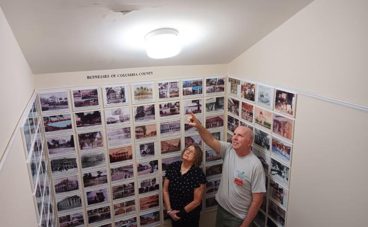 Kim Estergren, the Lake City-Columbia County Historical Museum president, and Sean McMahon, the museum’s vice president, point out where water is causing issues from a leak in the building’s roof. (TONY BRITT/Lake City Reporter)