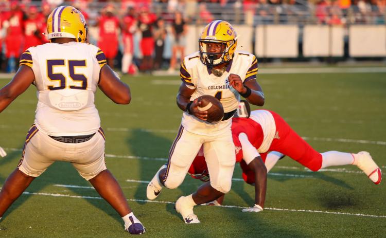 Columbia quarterback Zamarion Jones escapes a sack and scrambles up the field against Bradford during Friday’s Preseason Classic. (BRENT KUYKENDALL/Lake City Reporter)