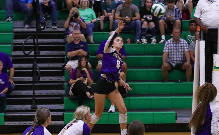 Columbia hitter Sinei Wood sends a shot over the net during Tuesday's match against Suwannee. (BRENT KUYKEDALL/Lake City Reporter)