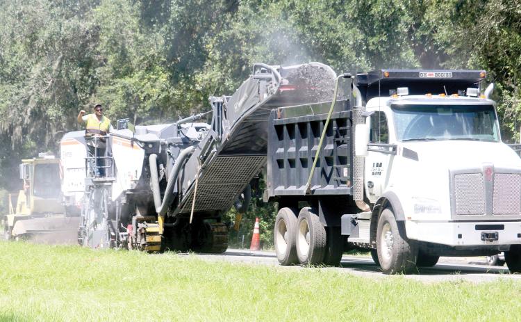 Crews from Anderson Columbia work Wednesday on resurfacing U.S. Highway 41 in southern Columbia County. The first layer of the project is nearly complete but the whole resurfacing and improvements is expected to last until next summer. (TONY BRITT/Lake City Reporter)