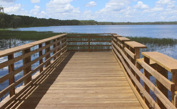 The wooden pier at the Olustee Beach Day Use Area boat ramp in the Osceola National Forest was recently refurbished and rehabilitated, providing a safer environment for fishing. (TONY BRITT/Lake City Reporter)