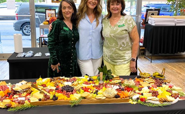 Sheila Carr (from left), curator of the Gateway Art Gallery stands with Abbie Chasteen Rosner, owner of  All Things Abbie, and Jeanne Van Arsdall, chairman of the Gateway Art Gallery’s 10th anniversary celebration and creator of the Charcuterie and Chardonnay fundraiser event. Konnie Patke (not pictured), director of the Tourist Development Agency, was the wine sommelier for the event. (COURTESY)