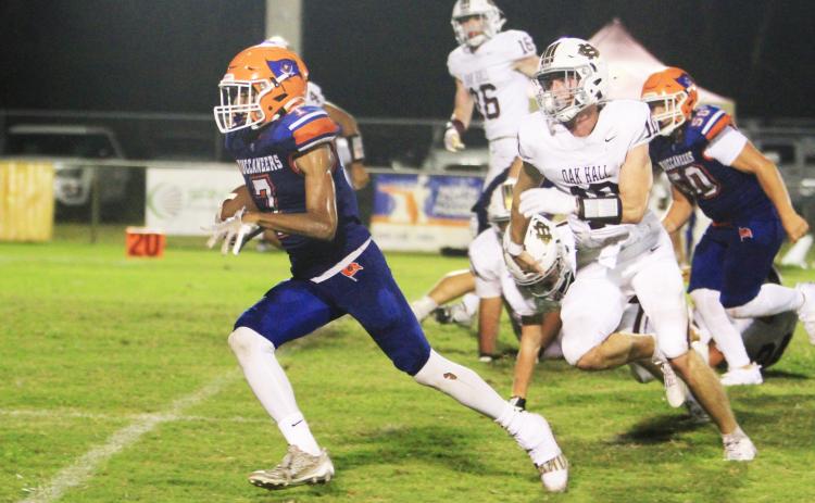 Branford receiver Ar’kayvion Jones runs past the Oak Hall defense last Friday. (PAUL BUCHANAN/Lake City Reporter)
