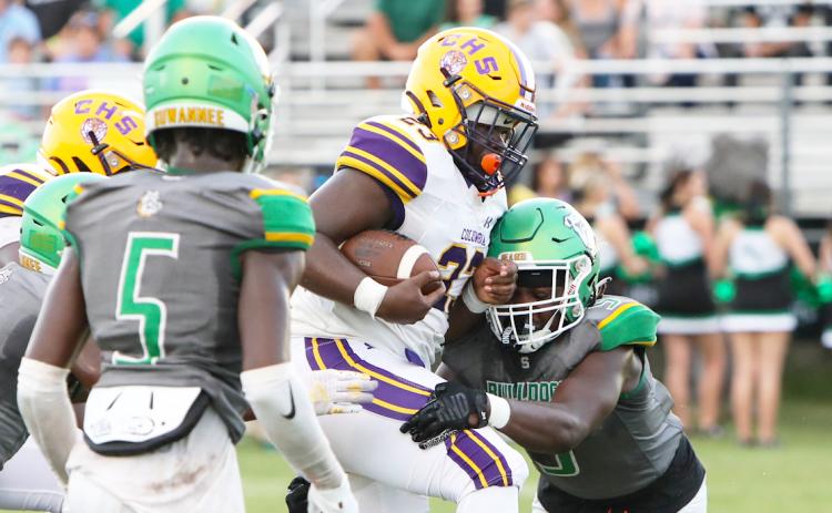 Suwannee linebacker Delwyn Allen dives to tackle Columbia running back Johnathan Andrews during last season’s Preseason Classic. (FILE)