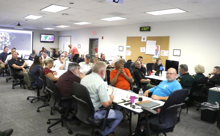 Columbia County Commissioner Ron Williams (center) asks Emergency Management Director Shayne Morgan a question during Wednesday’s EOC meeting. County and Lake City department heads also attended. (MORGAN MCMULLEN/Lake City Reporter)