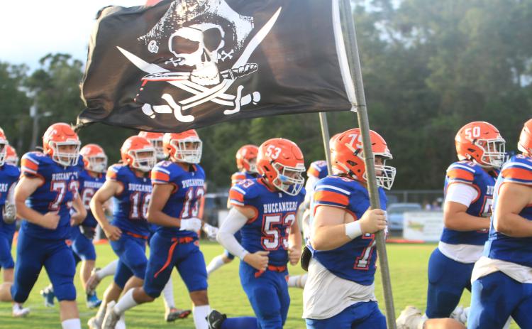 Branford takes the field prior to its game against Oak Hall on Aug. 23. (PAUL BUCHANAN/Special to the Reporter)