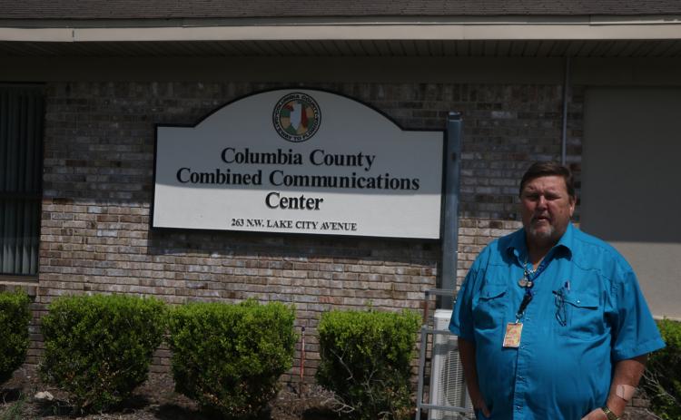Tom Brazil, Columbia County’s 911 director, stands outside the Combined Communications Center on Tuesday. The county and City of Lake City consolidated their emergency dispatch last week. There have been no major issues so far, Brazil said. (MORGAN MCMULLEN/Lake City Reporter)