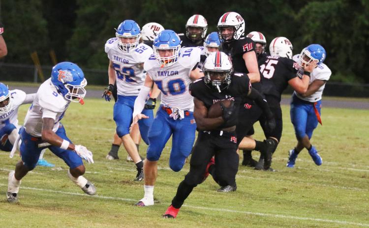 Fort White running back Keimarion Neal races up the field against Taylor County last Friday. (MORGAN MCMULLEN/Lake City Reporter)