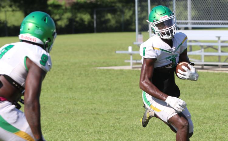 Suwannee receiver MJ Rossin turns up the field after catching a pass during Saturday’s practice. (JAMIE WACHTER/Lake City Reporter)