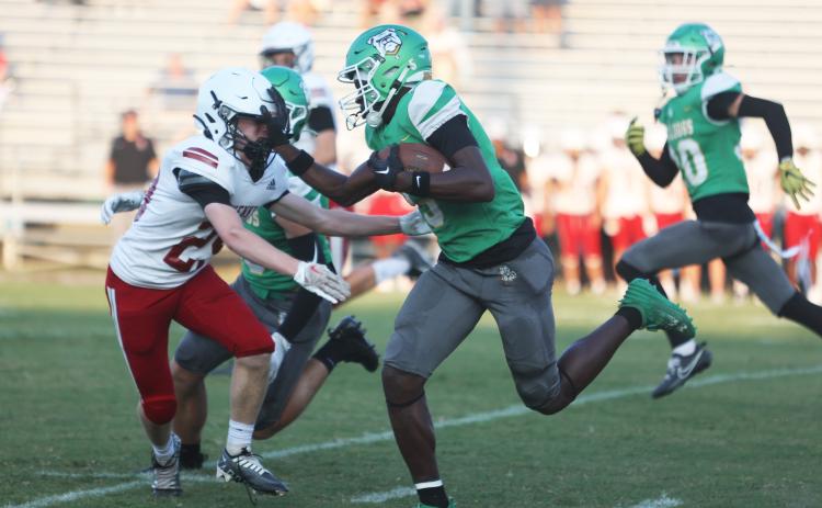 Suwannee receiver MJ Rossin stiff arms Bishop Kenny’s Brady Wagner as he returns the opening kickoff for a touchdown during Friday’s Preseason Classic. (PAUL BUCHANAN/Special to the Reporter)