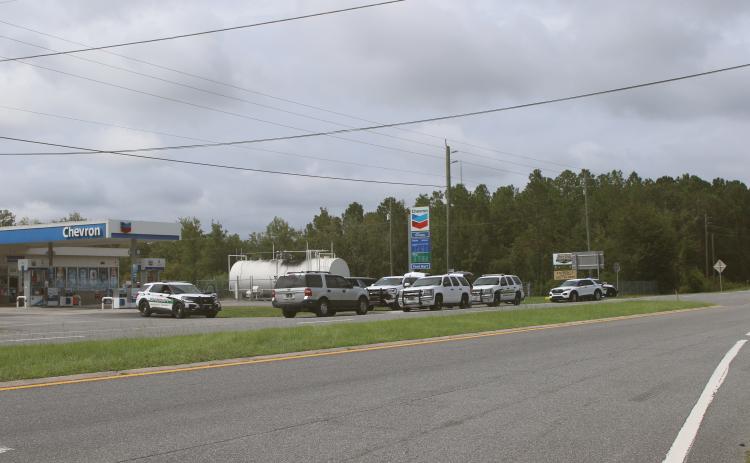 Columbia County Sheriff’s Office deputies set up operations near the intersection of Interstate 10 and U.S. Highway 441 on Monday afternoon while searching for a fugitive. (TONY BRITT/Lake City Reporter)