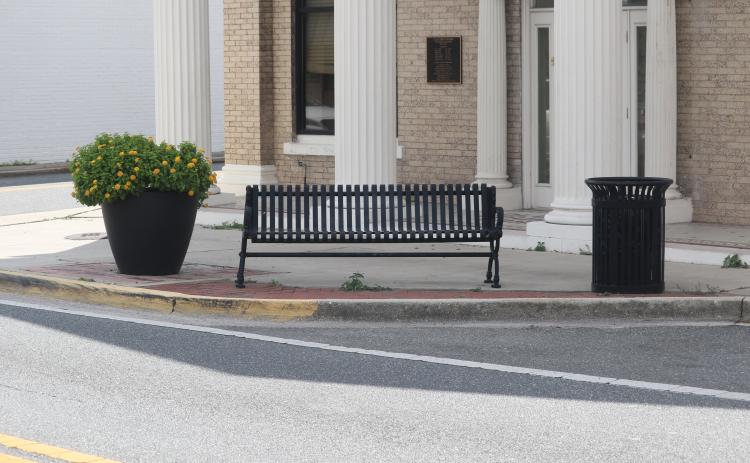 A city bench sits along N. Marion Avenue on Wednesday. Four similar benches were stolen Monday night from the city’s easements along Marion Avenue. (TONY BRITT/Lake City Reporter)