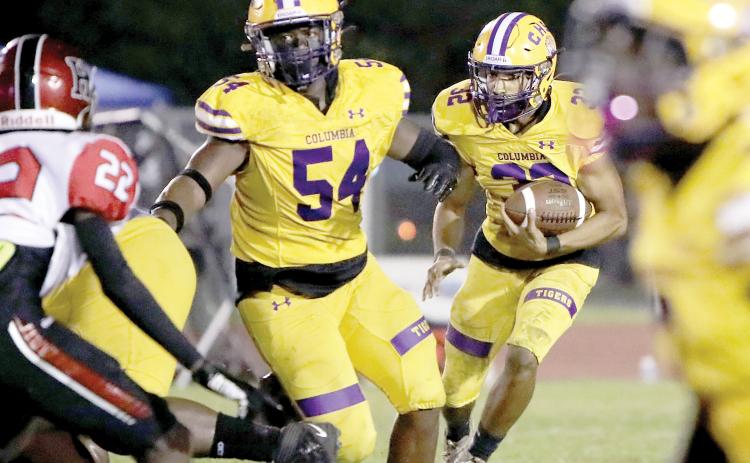 Columbia running back TC Smith follows a block from Issac Kimble against Hillsborough on Friday night. (BRENT KUYKENDALL/Lake City Reporter)