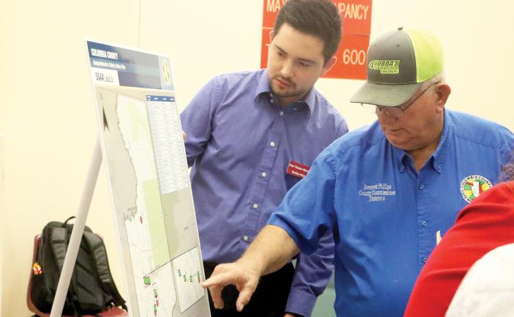 Columbia County Commissioner Everett Phillips (right) and Kimley-Horn’s Raul Pineda-Mendez look over a map of the Columbia County Comprehensive Safety Action Plan during an open house Thursday. (MORGAN MCMULLEN/Lake City Reporter)