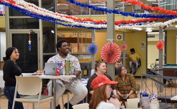 Florida Gateway College students, including D’Khari Jernigan (left) enjoy the activities offered during the college’s Constitution Day event Tuesday. (COURTESY)