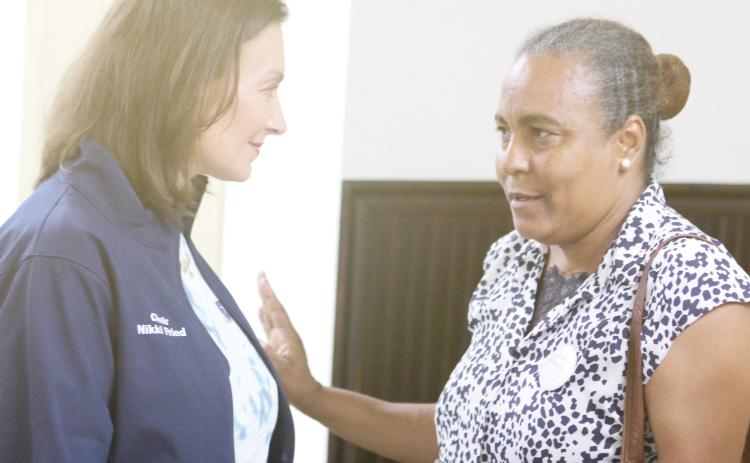 Nikki Fried, the Florida Democratic Party chair, talks with Nice Wells, of Gainesville, after a rally for the Kamala Harris presidential campaign at the Columbia County Woman’s Club on Sunday. (TONY BRITT/Lake City Reporter)