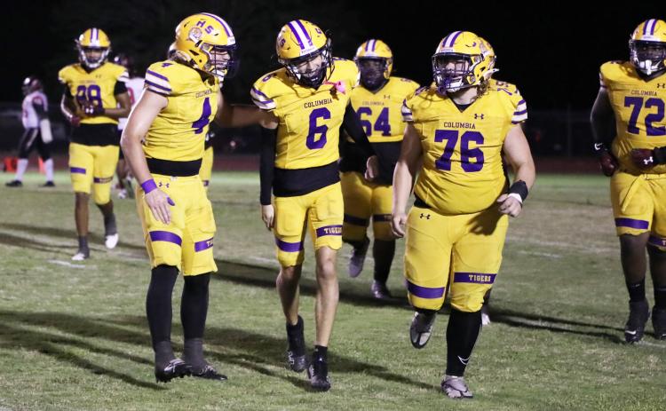 Columbia receiver Bynton Edge (6) celebrates alongside defensive end Ayden Phillips (4) and center Zackery Grimes (76) after one of his two touchdown catches against Hillsborough on Friday. (BRENT KUYKENDALL/Lake City Reporter)