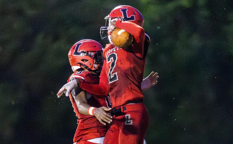 Lafayette receiver Jordan Murphy (2) celebrates with quarterback Tywan Williamson (9) after they connected for a touchdown against Brookwood on Friday. (JACK HOWDESHELL/Lake City Reporter)