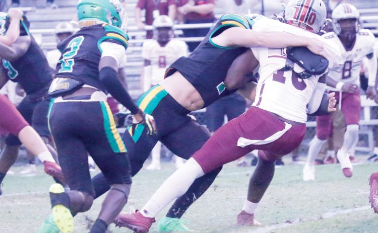 Suwannee linebacker Jace Moran tackles Madison County’s De’Andre Arnold last Friday night. (JAMIE WACHTER/Lake City Reporter)