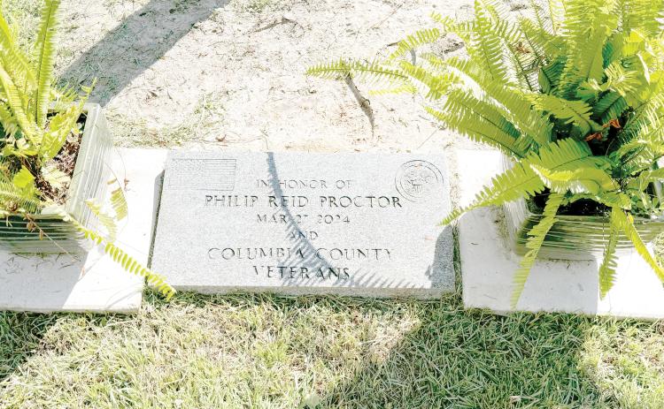 A marker honoring Philip Proctor and other Columbia County veterans rests at the base of the 35-foot flag pole at the Columbia County Veterans Park dedicated Monday by the American Legion Post 57. (JAMIE WACHTER/Lake City Reporter)
