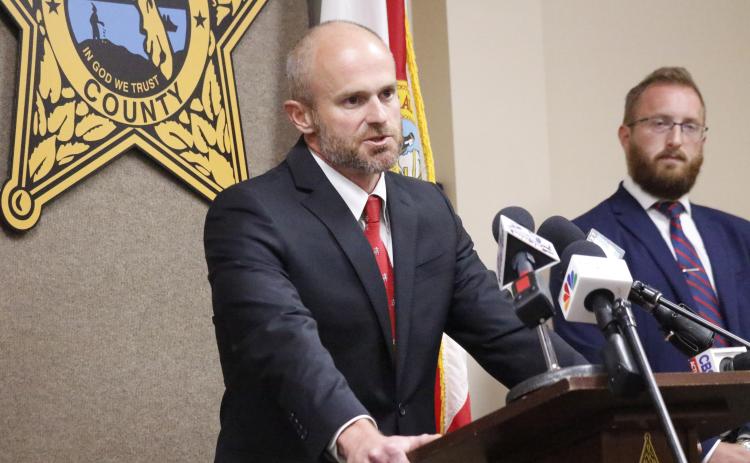 John Durrett, state attorney for the Third Judicial Circuit, said Wednesday that social media threats are not a joke, warning anyone that makes a threat will face consequences for their actions. Assistant State Attorney Chase Larsen looks on. (JAMIE WACHTER/Lake City Reporter)