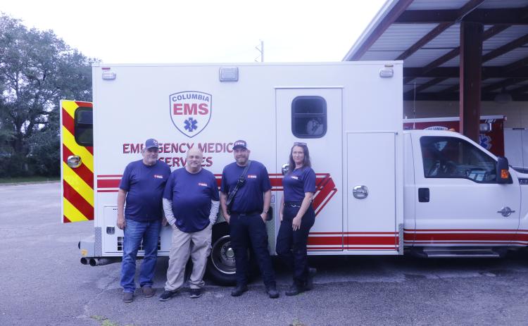 Columbia EMS, which will serve as Columbia County’s 911 emergency medical service provider starting Oct. 1, already has two trucks on the road. Among the Columbia EMS team are Toby Witt (from left), Mike Broshar, Aaron Smith and Cherie Lawrence. (JAMIE WACHTER/Lake City Reporter)