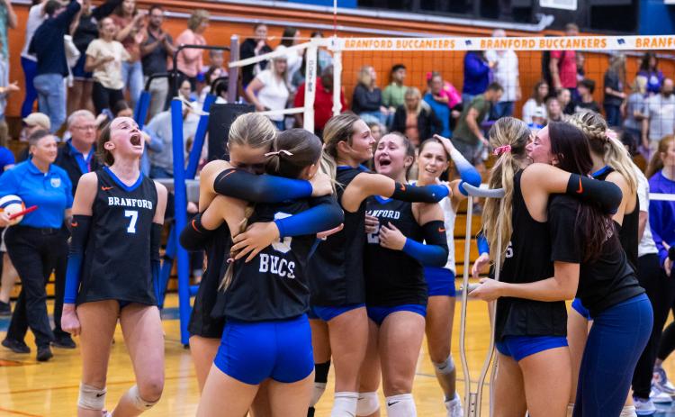 Branford celebrates after winning the fifth set to beat Union County in the Region 3-R championship on Tuesday. (JACK HOWDESHELL/Lake City Reporter)