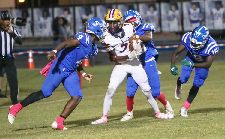 Columbia receiver Kyren Caldwell catches a touchdown pass while surrounded by Clay defenders during his team’s 49-13 win Friday. (BRENT KUYKENDALL/Lake City Reporter)