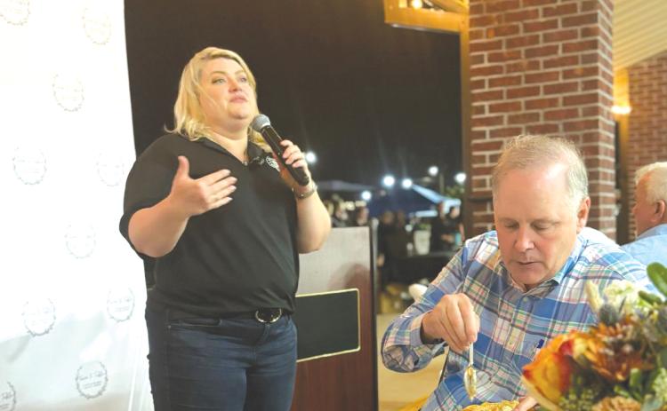 U.S. Rep. Kat Cammack (R-Gainesville) speaks during Thursday’s Farm To Table fundraiser as Ag Commissioner Wilton Simpson dines on chicken pot pie. (COURTESY)