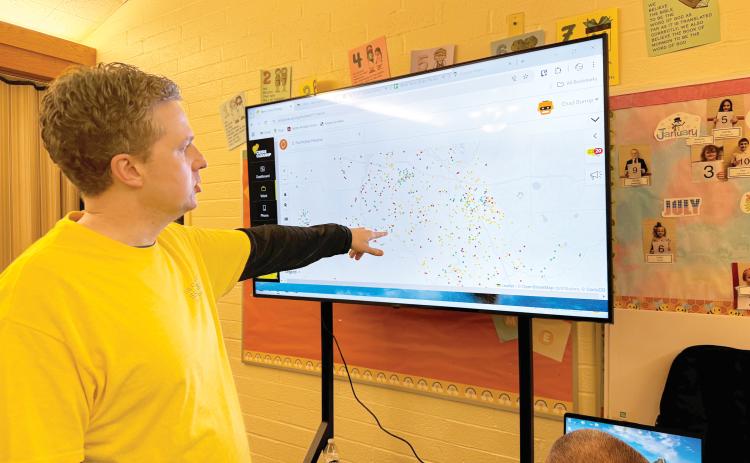Andrew Miner, the president of the Cocoa Beach Stake of the Church of Jesus Christ of Latter-day Saints, looks at a map of the cleanup work needed in North Florida following Hurricane Helene. (JAMIE WACHTER/Lake City Reporter)