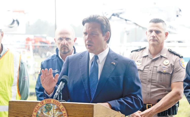 Gov. Ron DeSantis gives an update on Hurricane Milton from the Florida Gateway Fairgrounds on Wednesday afternoon. DeSantis said the state government is undertaking a “massive” response to Milton’s arrival. (MORGAN MCMULLEN/Lake City Reporter)