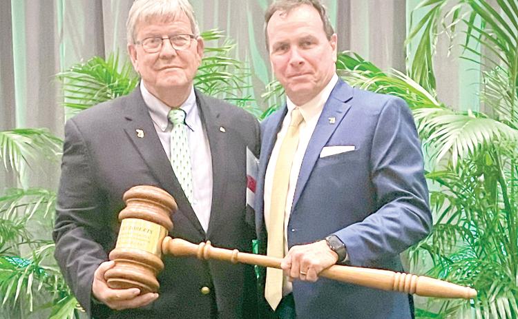 Avery C. Roberts (right) accepts gavel from outgoing president Jimmy Bielling at the Florida Forestry Association 2024 annual meeting. (COURTESY)