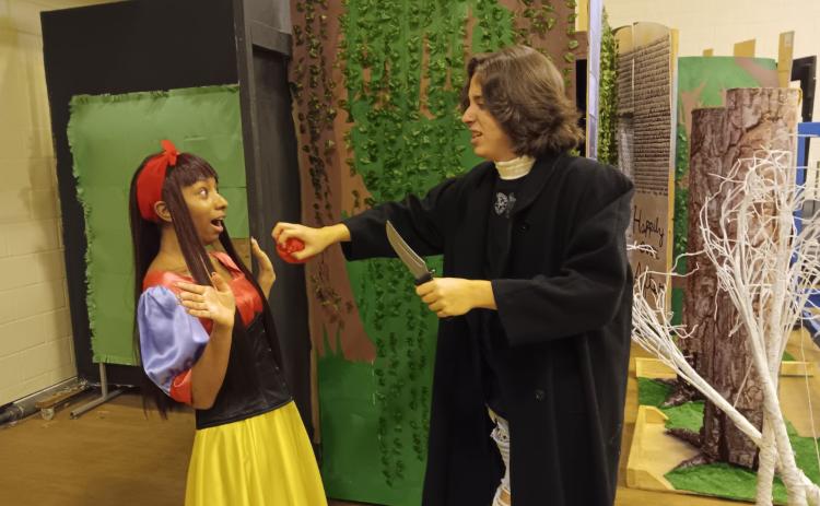 Asher Watson pulls the heart out of Gelissa Howard, who is portraying Snow White, in the Snow White room of the Columbia High theatre department’s haunted house of ‘The Real Grimm’s Fairytales.’ (TONY BRITT/Lake City Reporter)