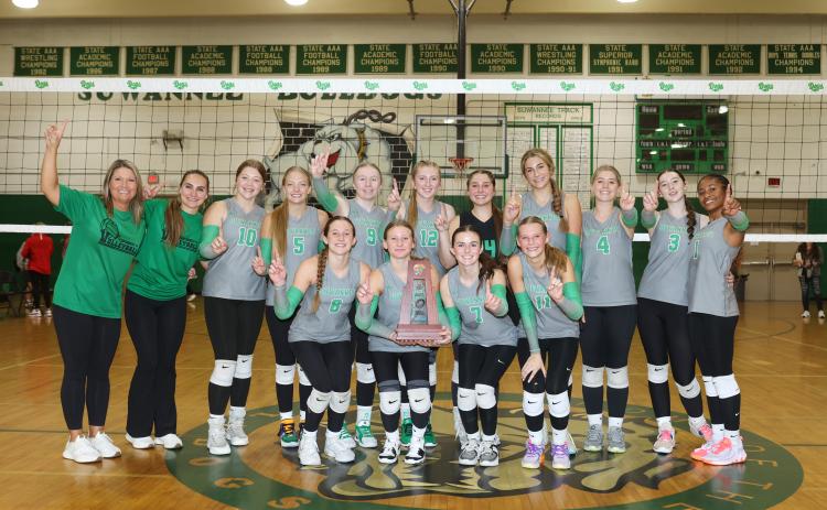 Suwannee's volleyball team poses with the District 2-4A championship trophy after rallying to beat Wakulla on Thursday night. (PAUL BUCHANAN/Lake City Reporter)