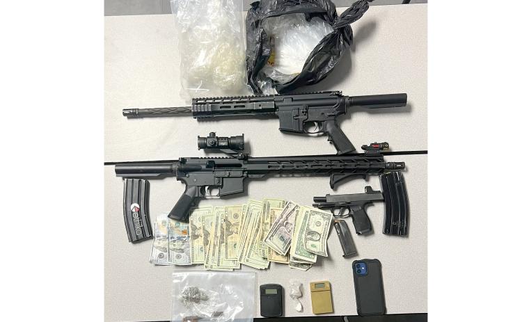 The Lake City Police Department seized firearms, drugs and drug paraphernalia out of a vehicle at the Cedar Park apartments after someone reported individuals placing the firearms into the car’s trunk. (COURTESY LAKE CITY POLICE DEPARTMENT)