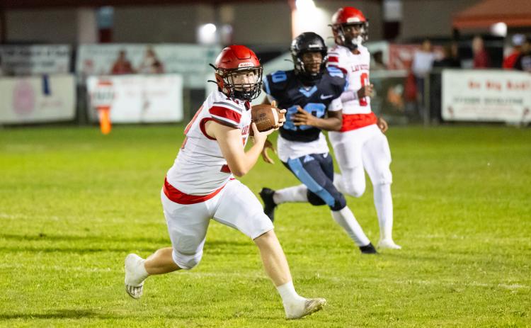 Lafayette receiver Tucker Higginbothom turns up field after catching a pass against Zarephath Academy on Sept. 20. (JACK HOWDESHELL/Lake City Reporter)
