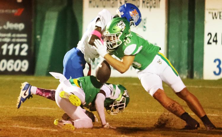 Suwannee safety Koy Frier forces a fumble with a big hit on Taylor County receiver James Mingo on Friday. (PAUL BUCHANAN/Lake City Reporter)